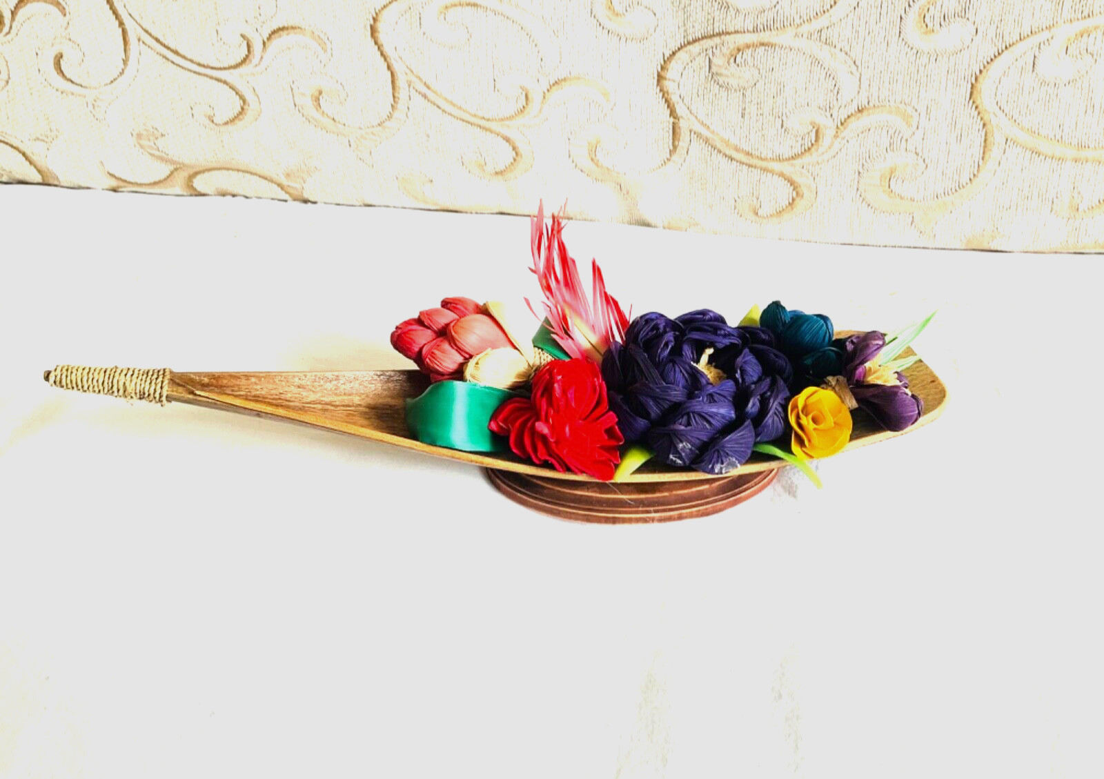 flower arrangements. Coconut spathe vase, dried corn husks, naturals.