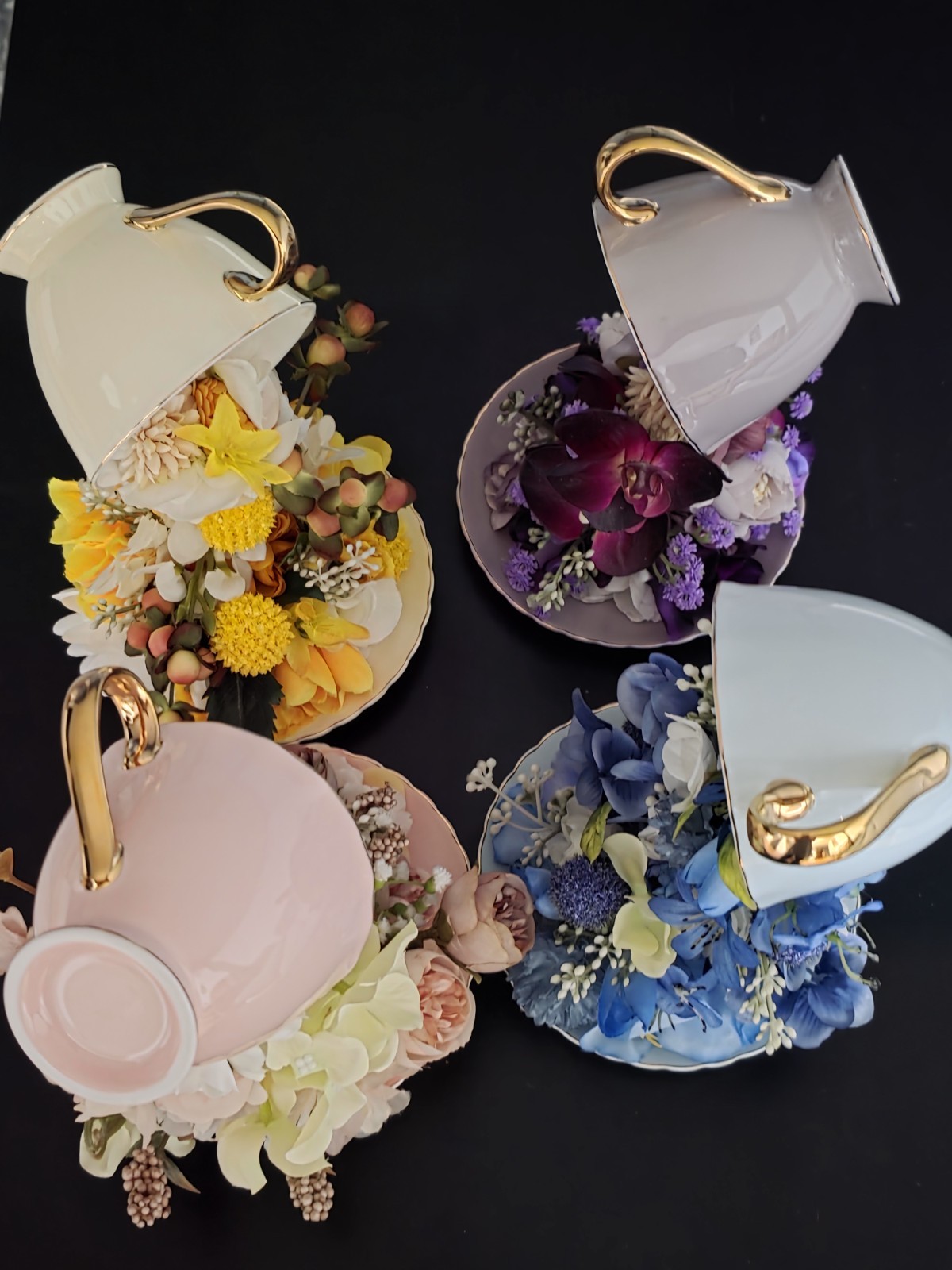 Floating Tea Cup Decorated With Faux Flowers Arrangement
