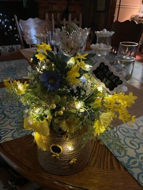 Hand made bee hive flower, with bees that light up, battery is included.