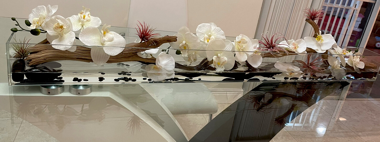 Silk orchid floral arrangement in rectangular glass vaseorchids arrangements48”