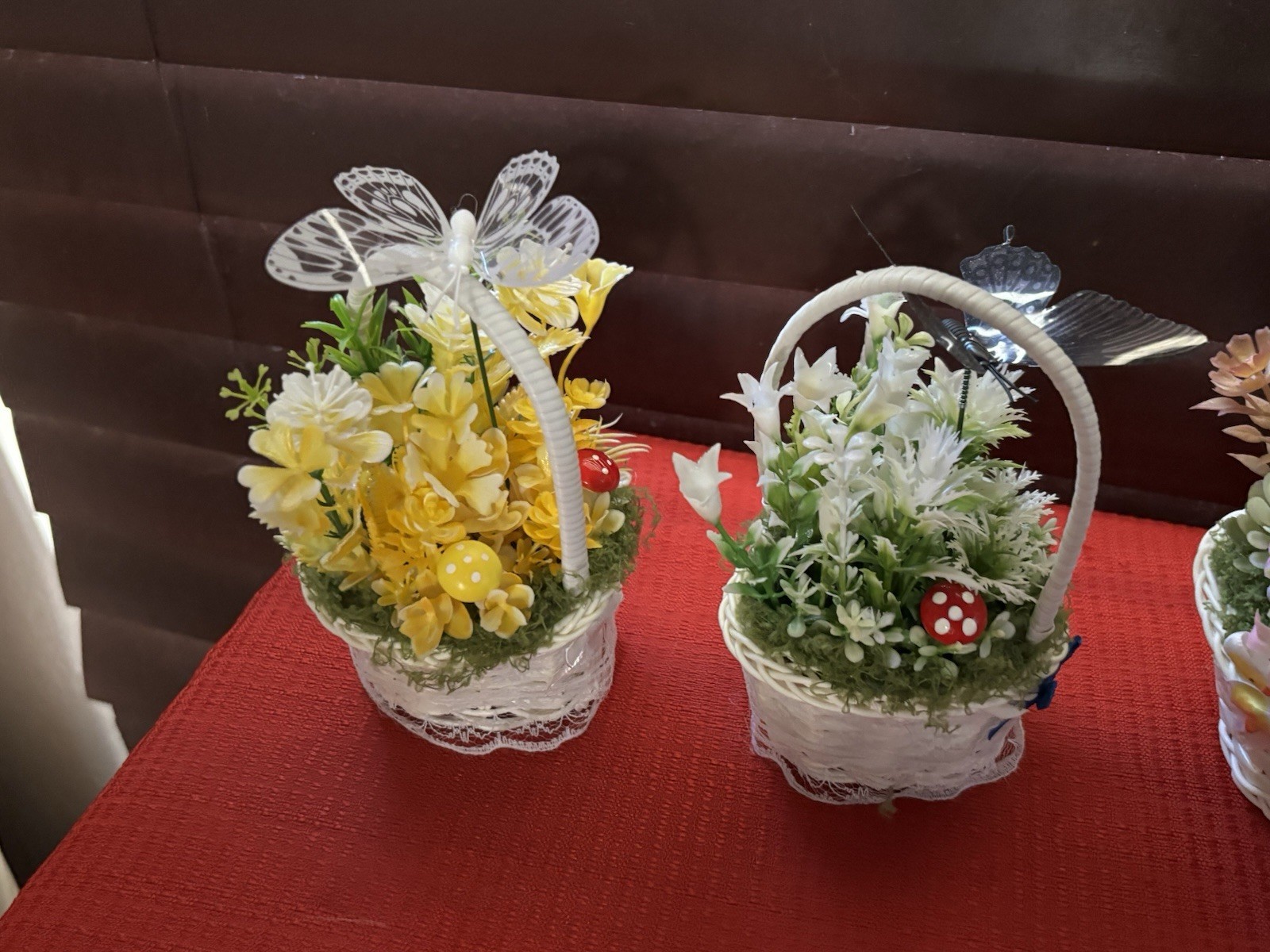 Artificial Floral Arrangement in White Wicker Baskets, Butterfly Accent