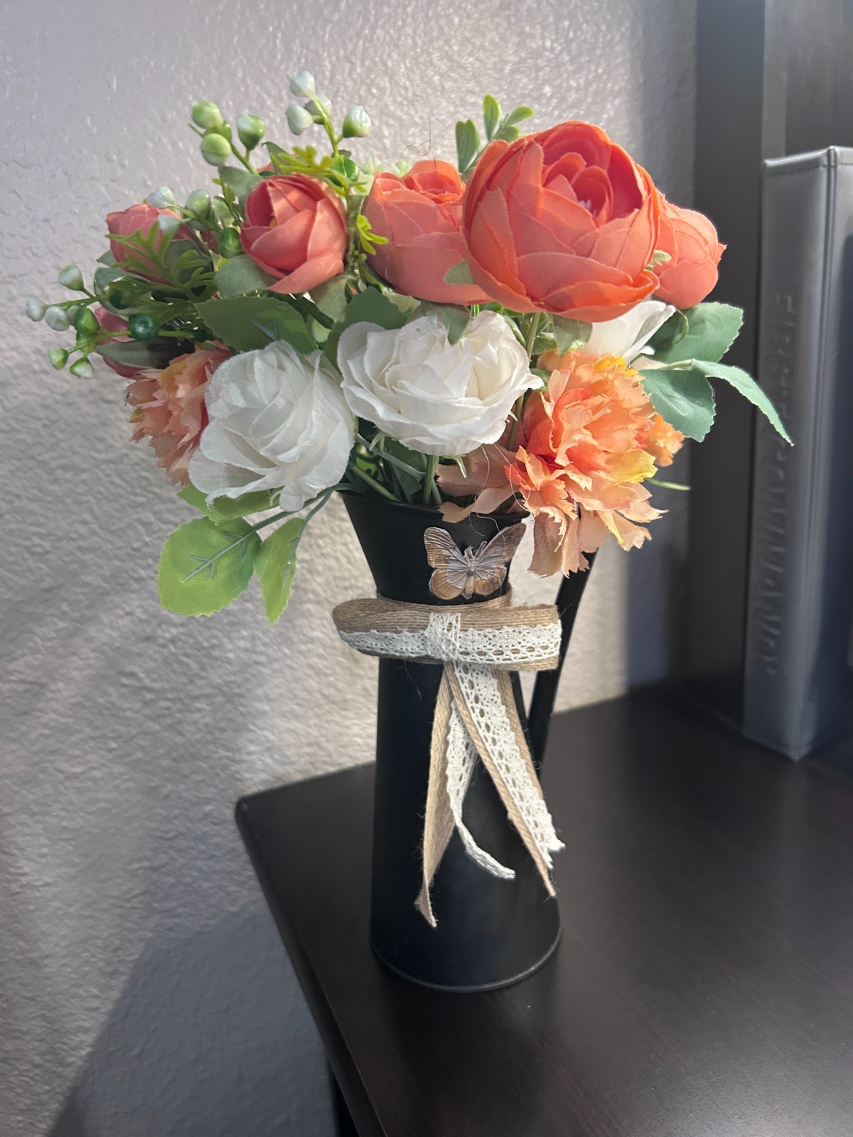 Handmade orange and white artificial flower arrangement