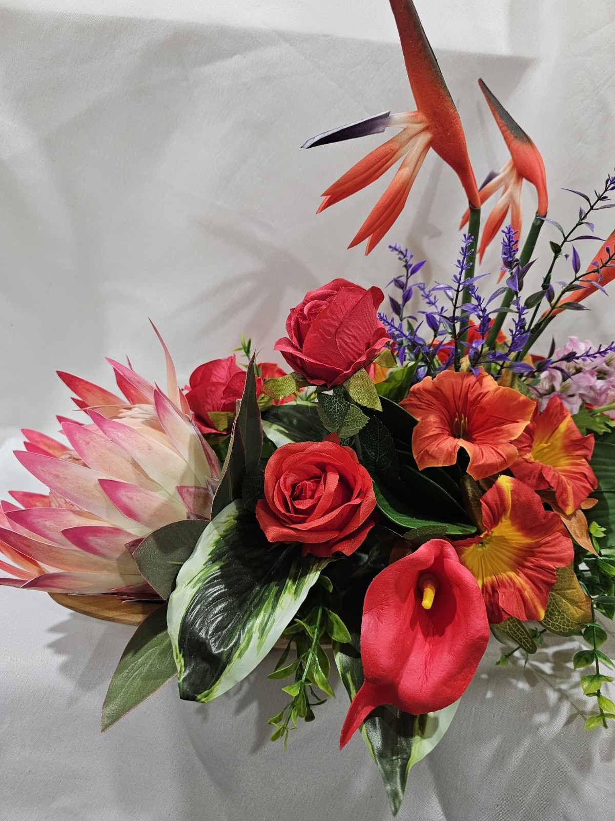 Bright Colors in this Artificial Tropical arrangement, Birds of Paradise etc.