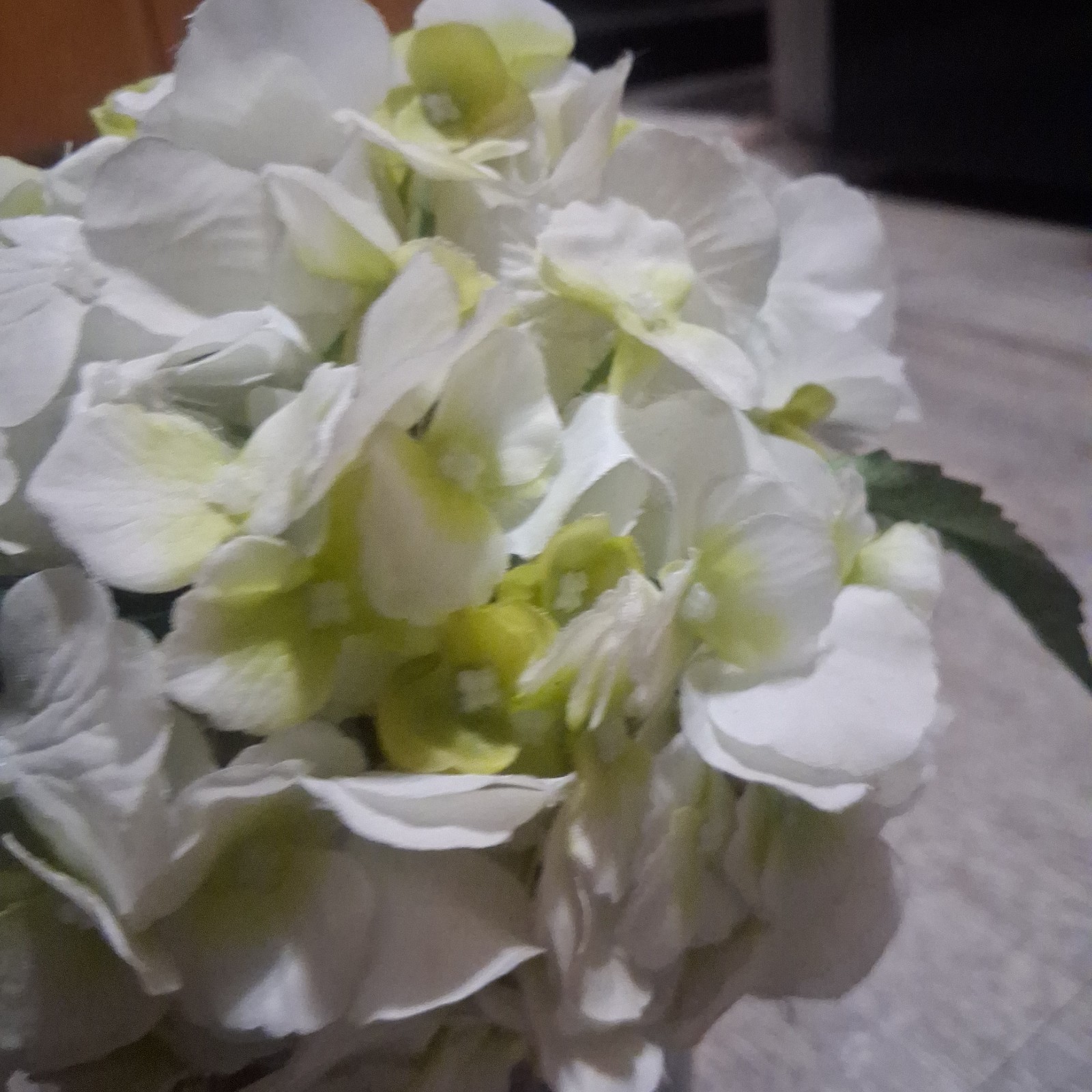 lifelike cream-white artificial silk hydrangea floral arrangement.