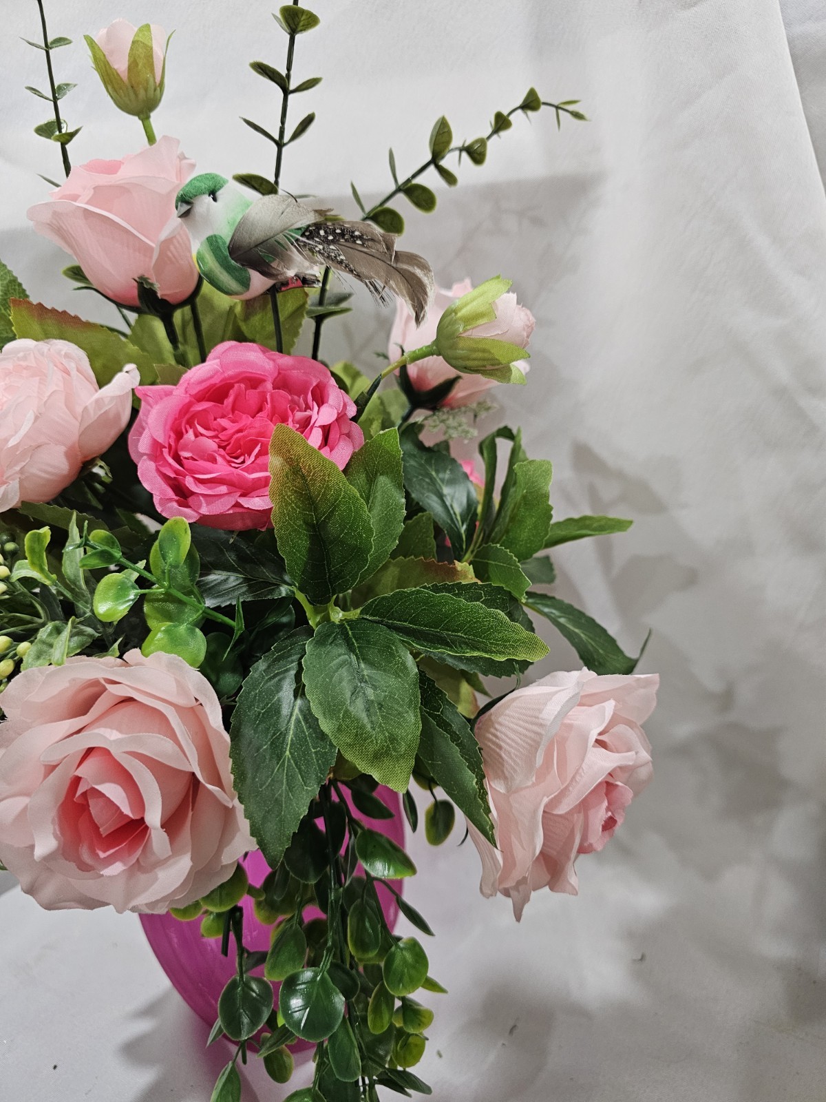 Varied Colors of soft Pink Artificial Roses in a beautiful pink vase