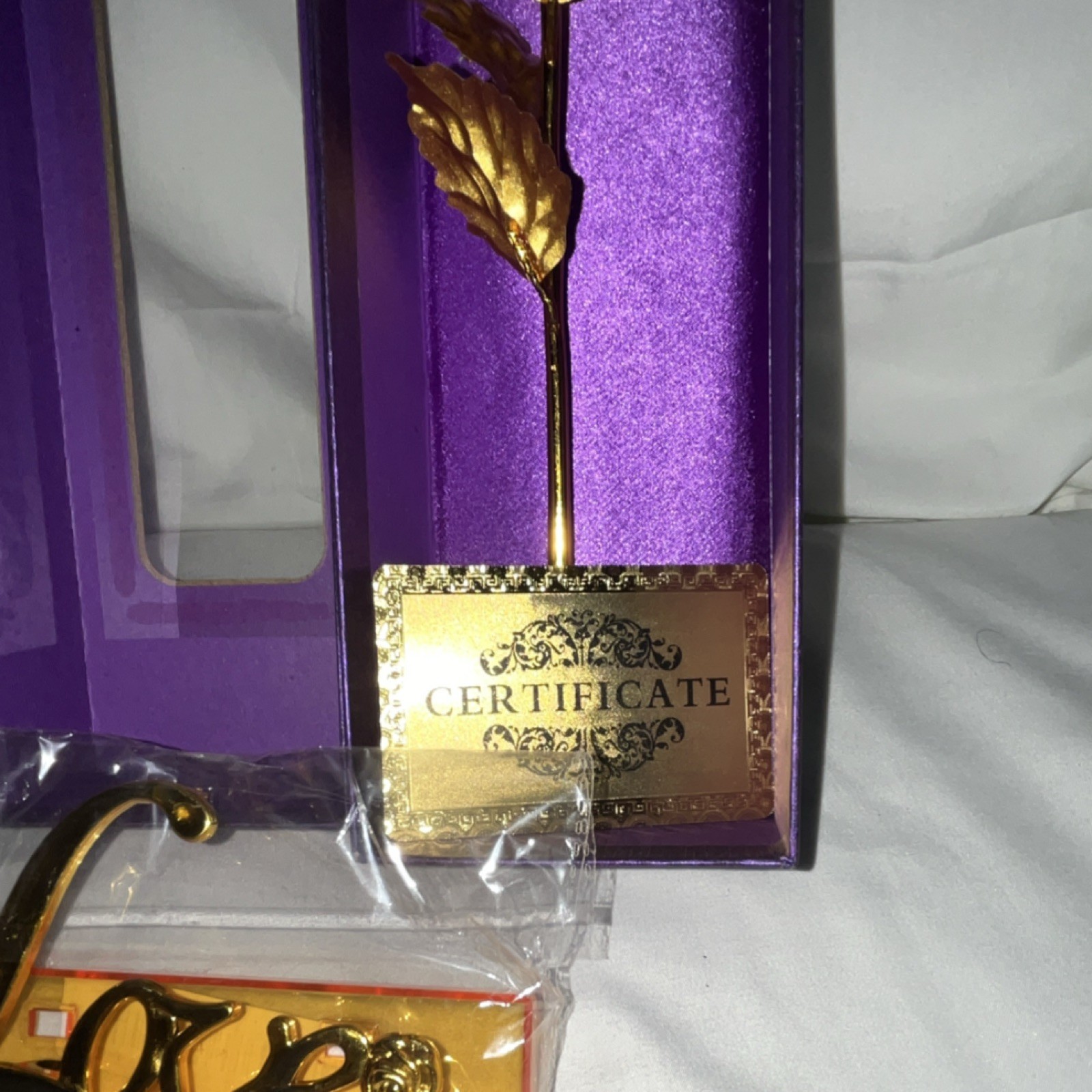 Artificial Gold Rose Metal Flower Stem with ‘Love’ Stand in Purple Gift Box