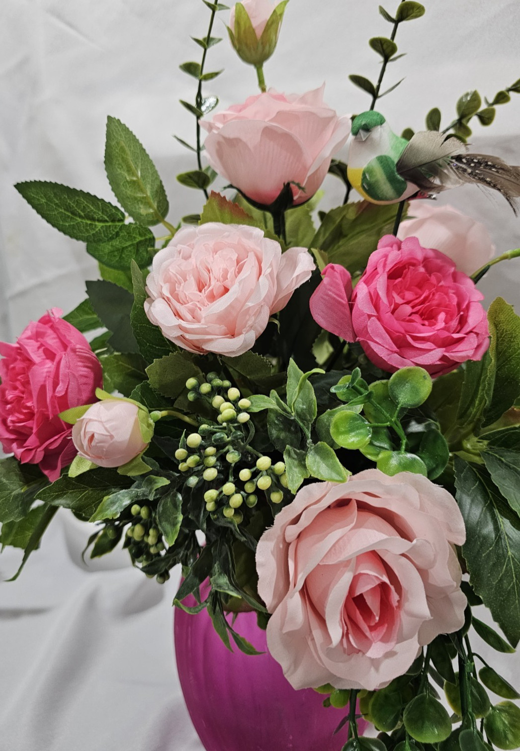 Varied Colors of soft Pink Artificial Roses in a beautiful pink vase