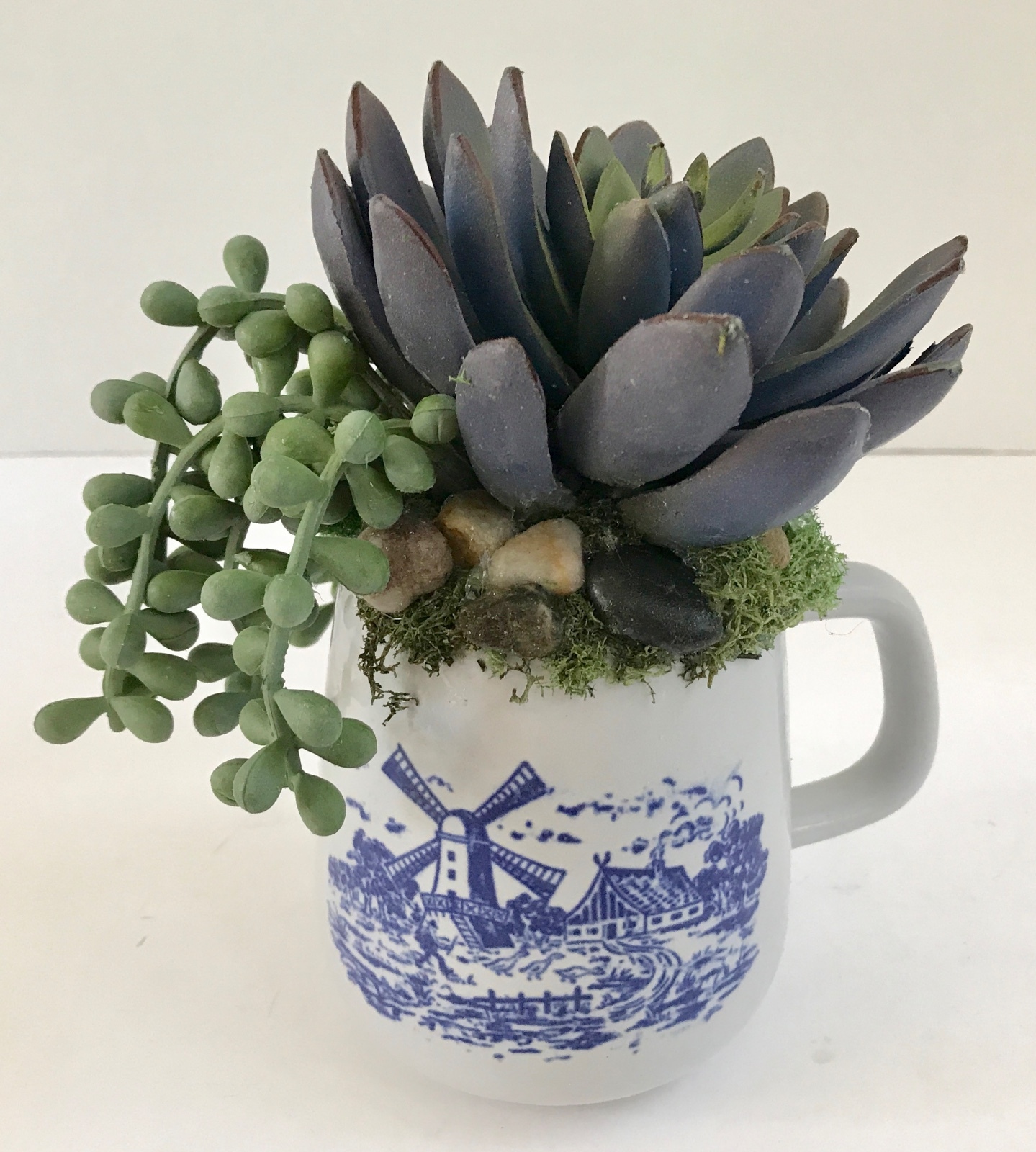 Decorative Artificial Purple and Green Grass Succulents in a Blue and White Mug