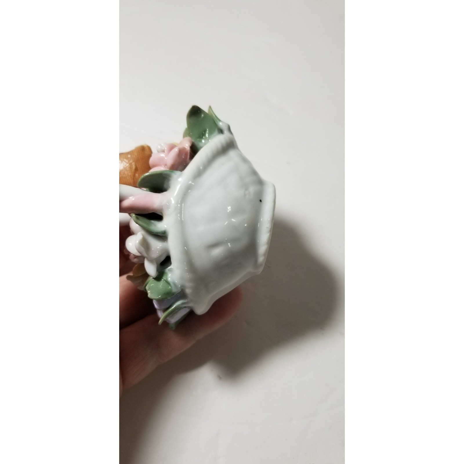 Three inch by 3 inch hand painted porcelain basket (1.1282)