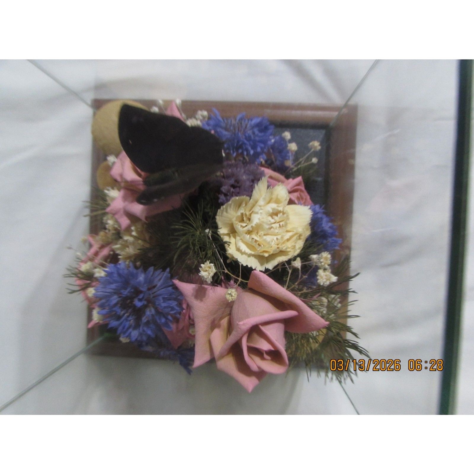 Vintage dried flower arrangement in glass with wood base butterfly mushrooms