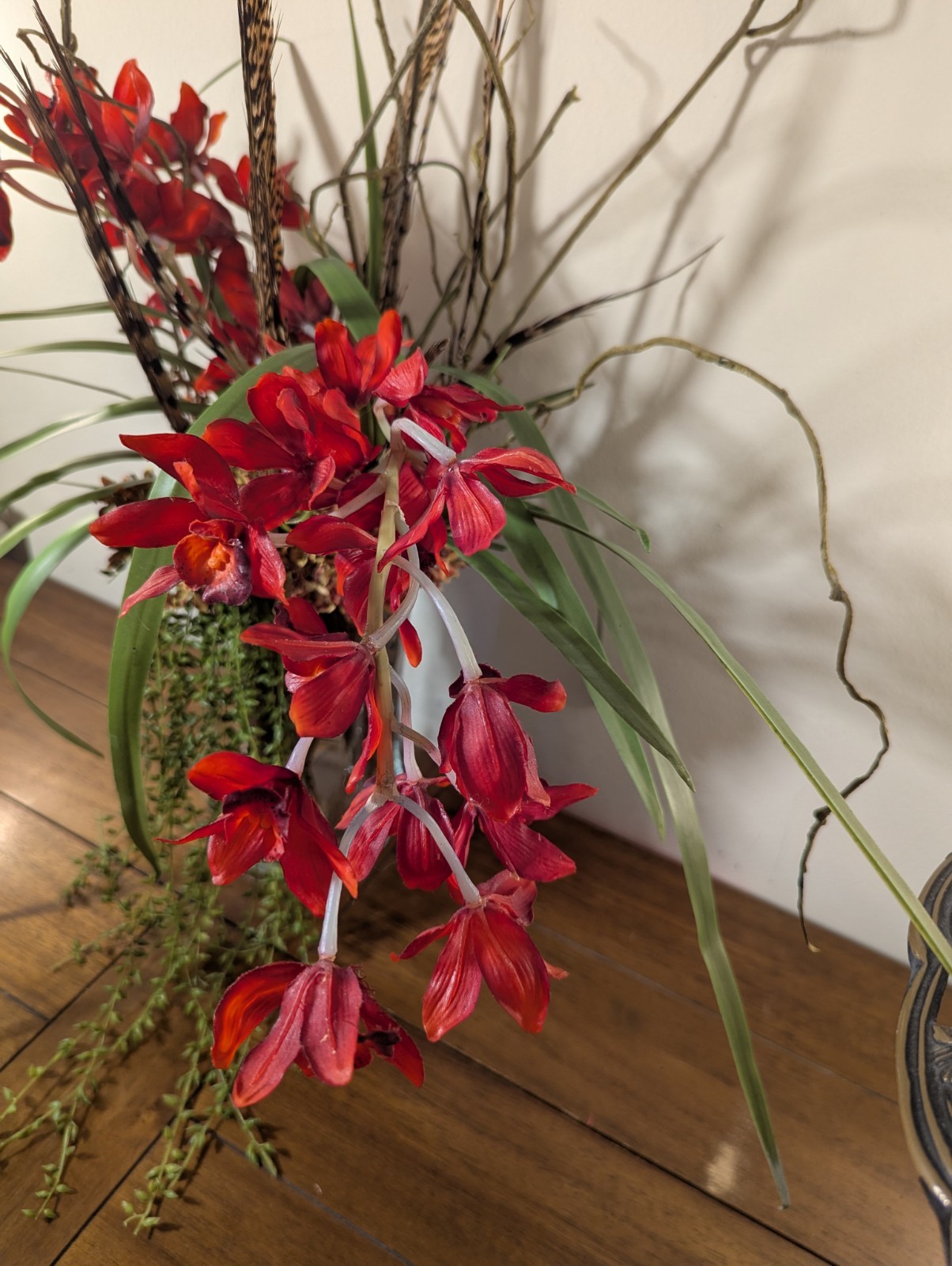 Faux Floral Arrangement With Clear Circular Vase Red Orchards Trailing Greenery