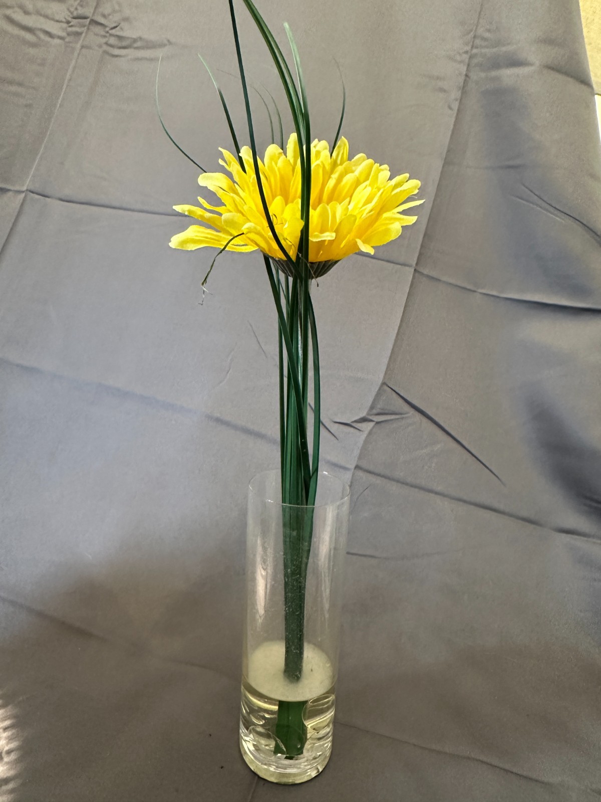 Faux Yellow Gerbera Daisy arrangement in a clear glass cylinder vase