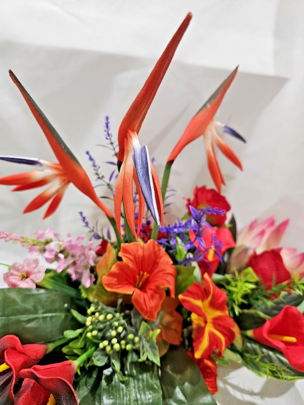 Bright Colors in this Artificial Tropical arrangement, Birds of Paradise etc.