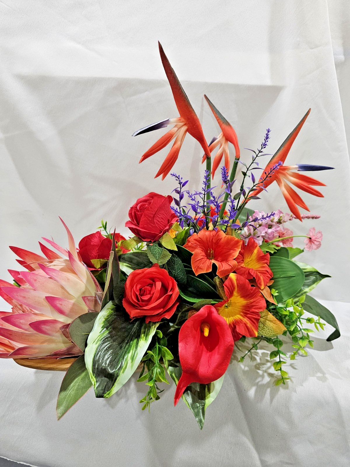 Bright Colors in this Artificial Tropical arrangement, Birds of Paradise etc.