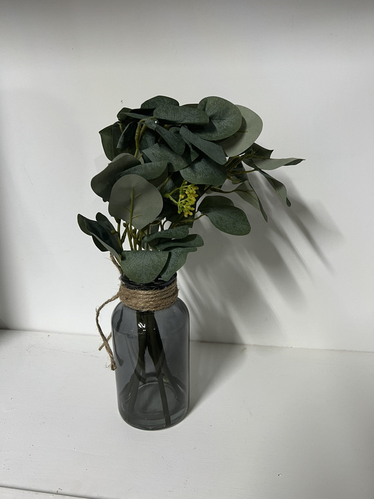 Artificial Eucalyptus Stems in Black Glass Vase with Faux Water, 14″, With Bow