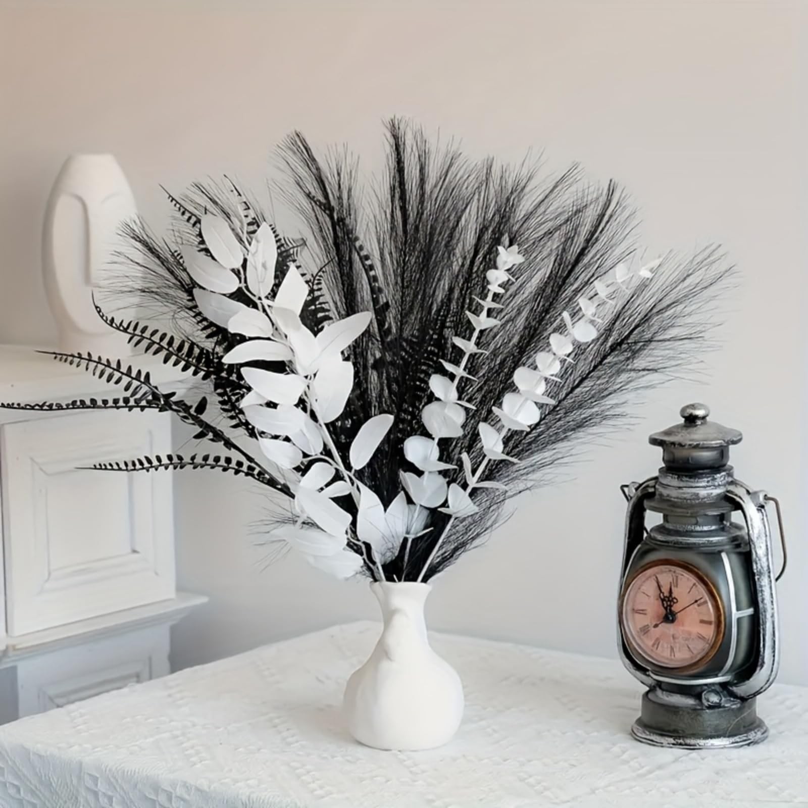 Black and white artificial bouquet in minimalist Nordic style, featuring arti…
