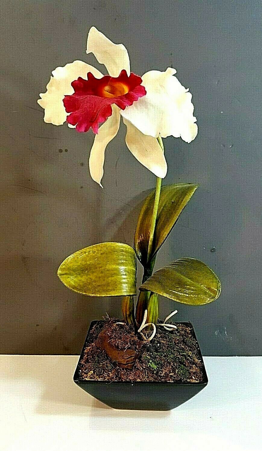 ARTIFICIAL RED & WHITE ORCHID IN A BLACK CERAMIC PLANTER