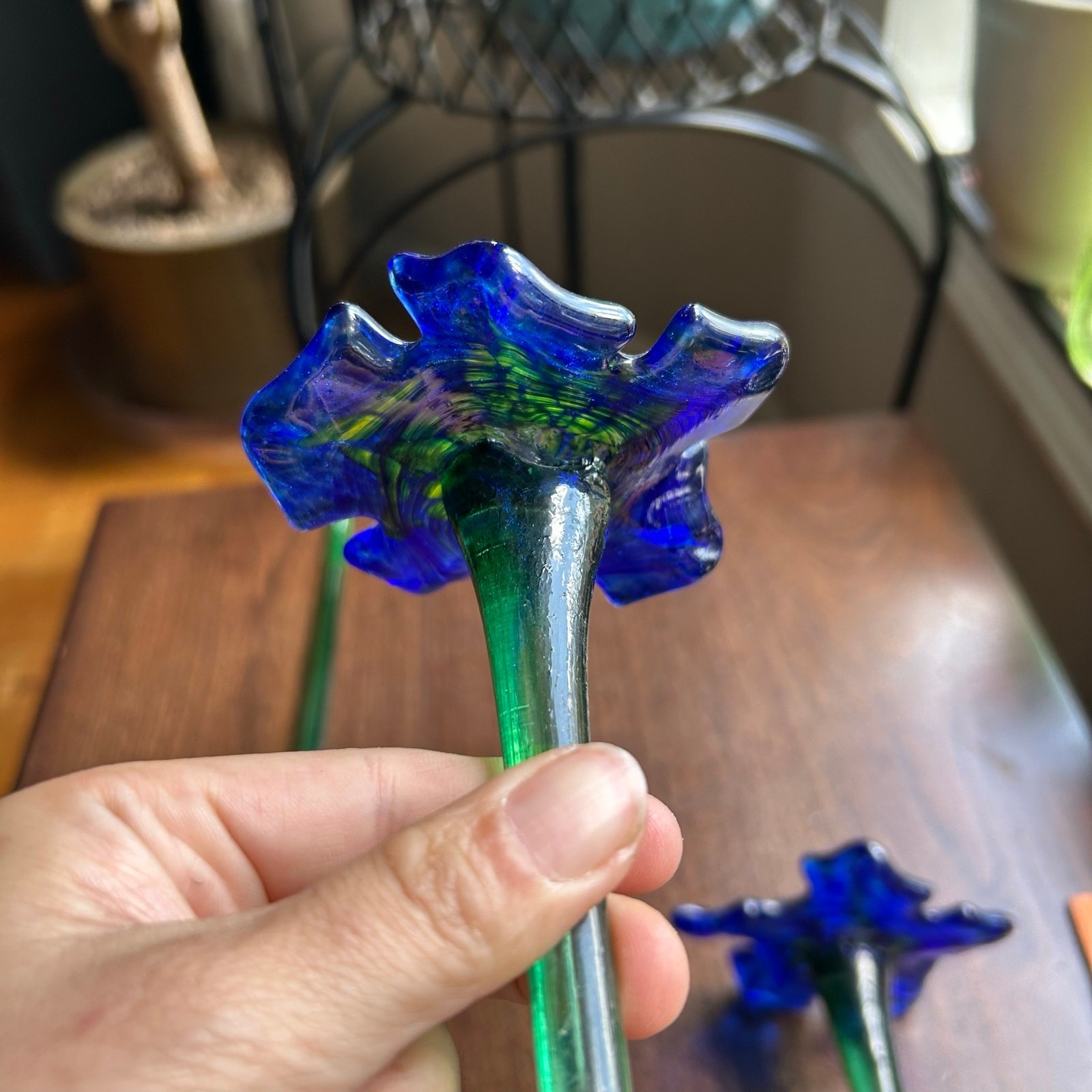 Handcrafted blue and yellow glass flower sculptures long green stems
