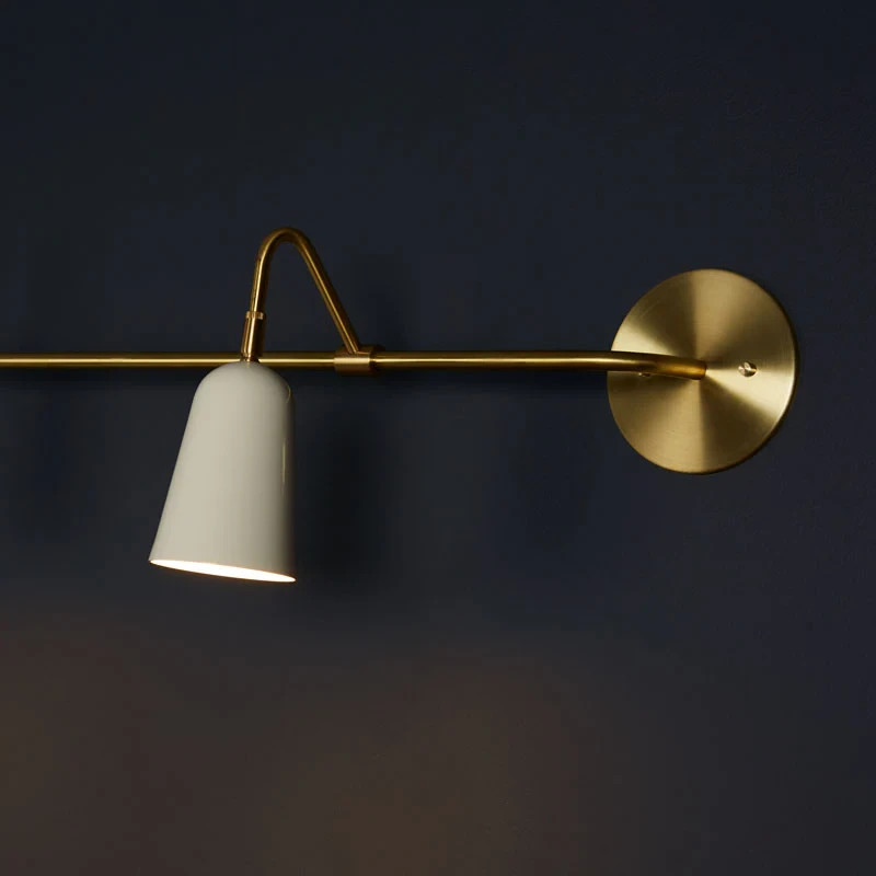 The Perry Double Sconce features solid brass hardware and powder coated aluminum
