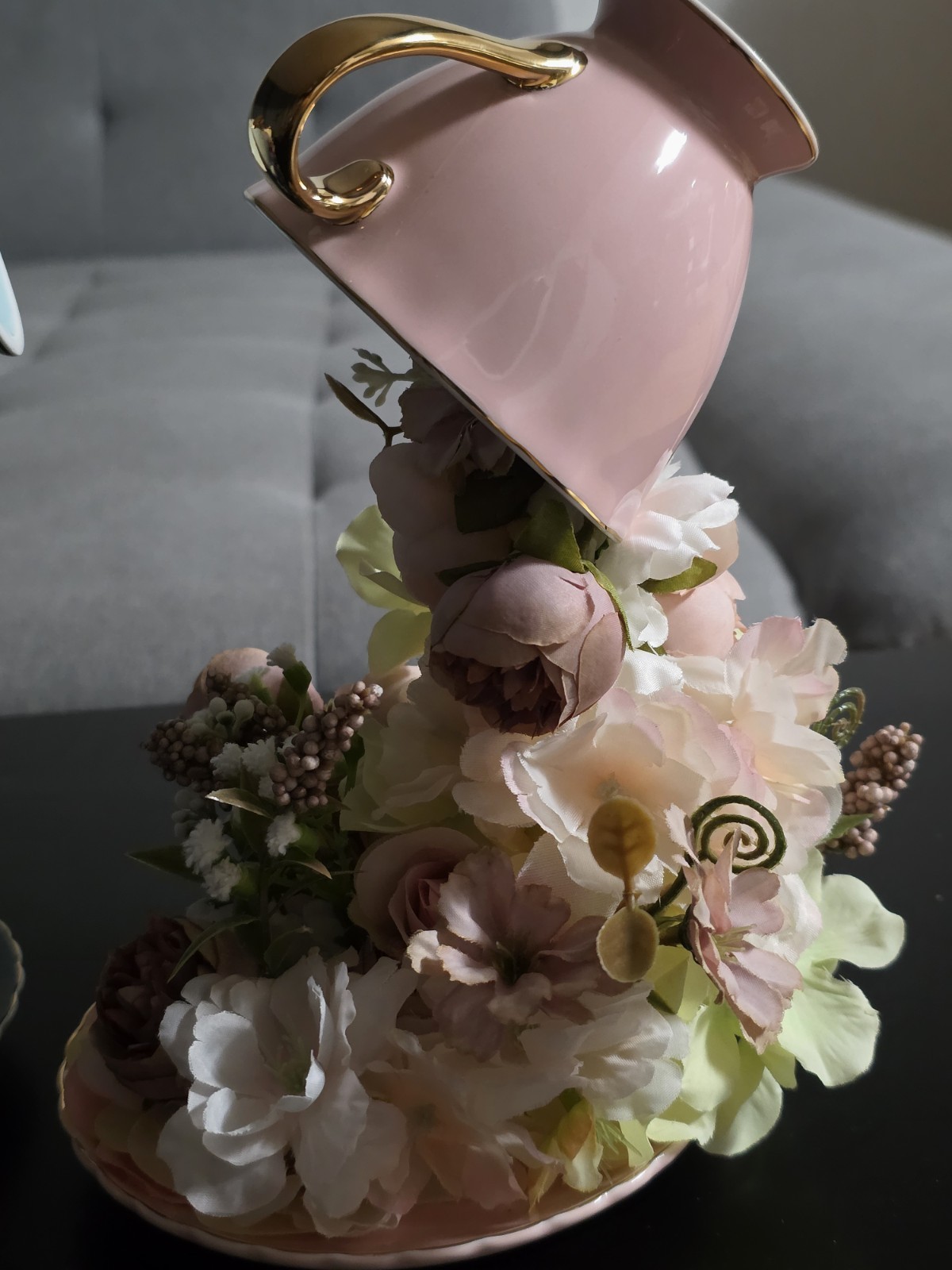 Floating Tea Cup Decorated With Faux Flowers Arrangement