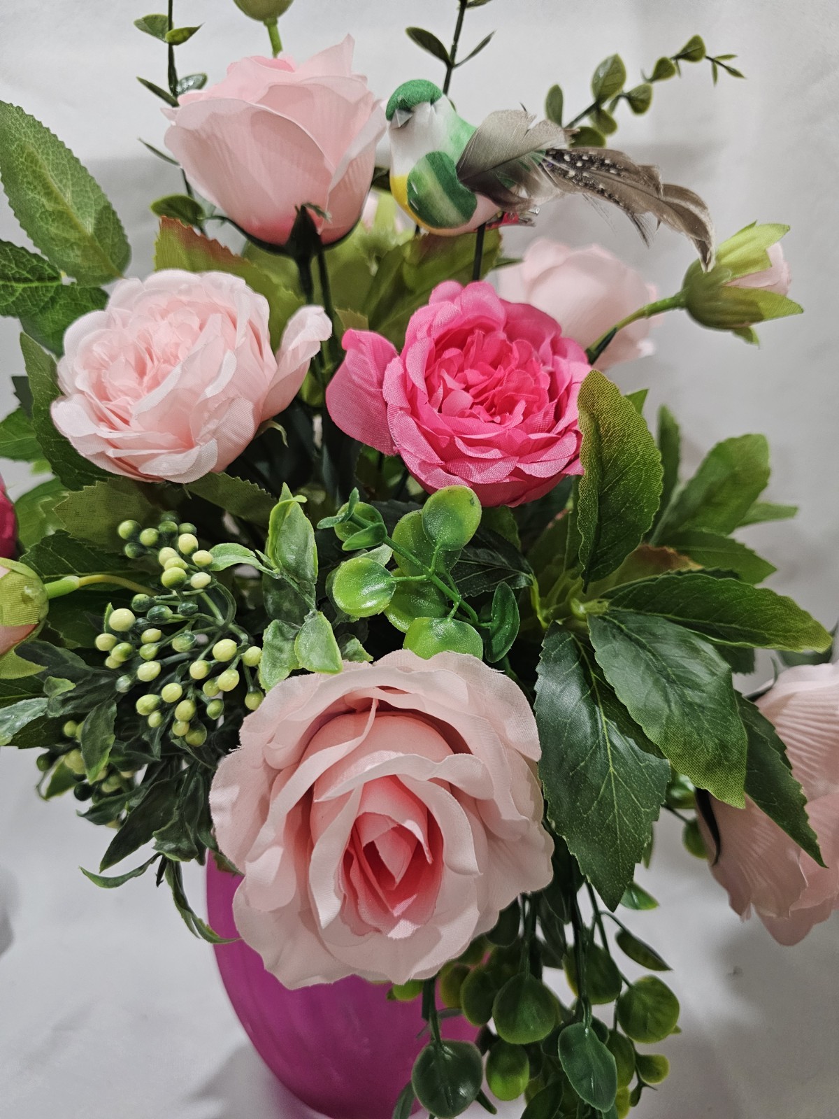 Varied Colors of soft Pink Artificial Roses in a beautiful pink vase