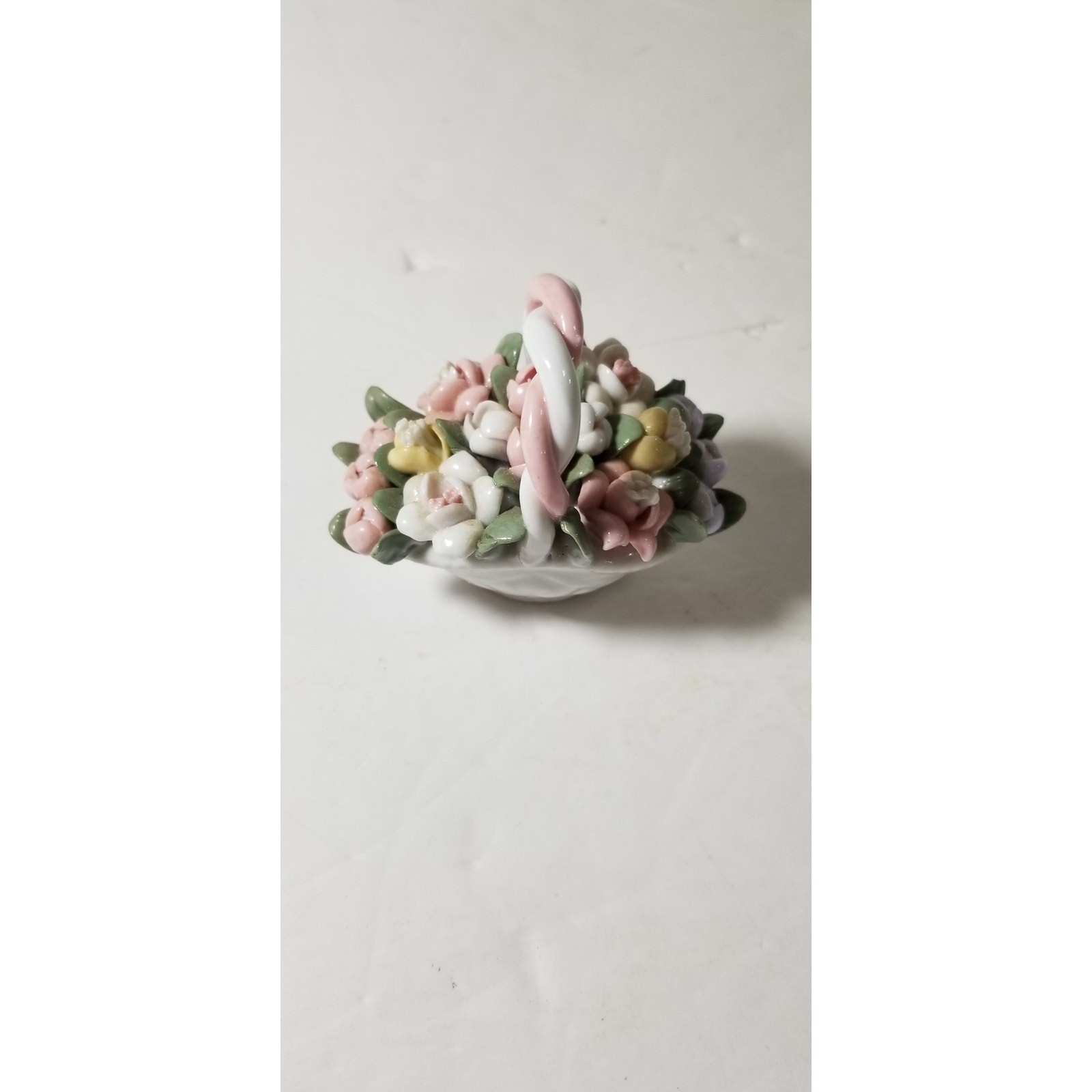 Three inch by 3 inch hand painted porcelain basket (1.1282)