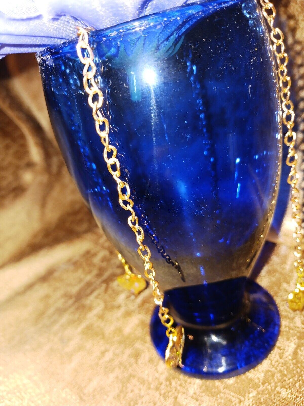 Artificial Flower Arrangement With Blue Glass Vase And Gold Chain Accent /Hearts