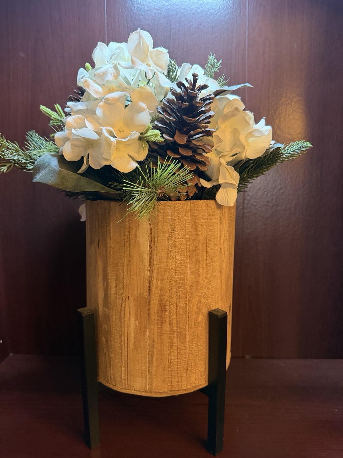 Artificial Pine Plant With White Flowers And Pinecones In Stand