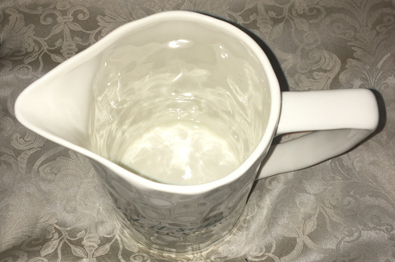 creative co-op ceramic 9 1/2 inch Let It Snow￼pitcher