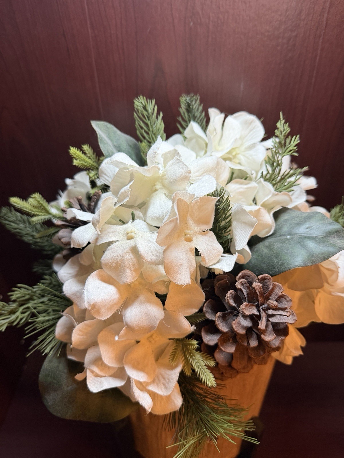 Artificial Pine Plant With White Flowers And Pinecones In Stand