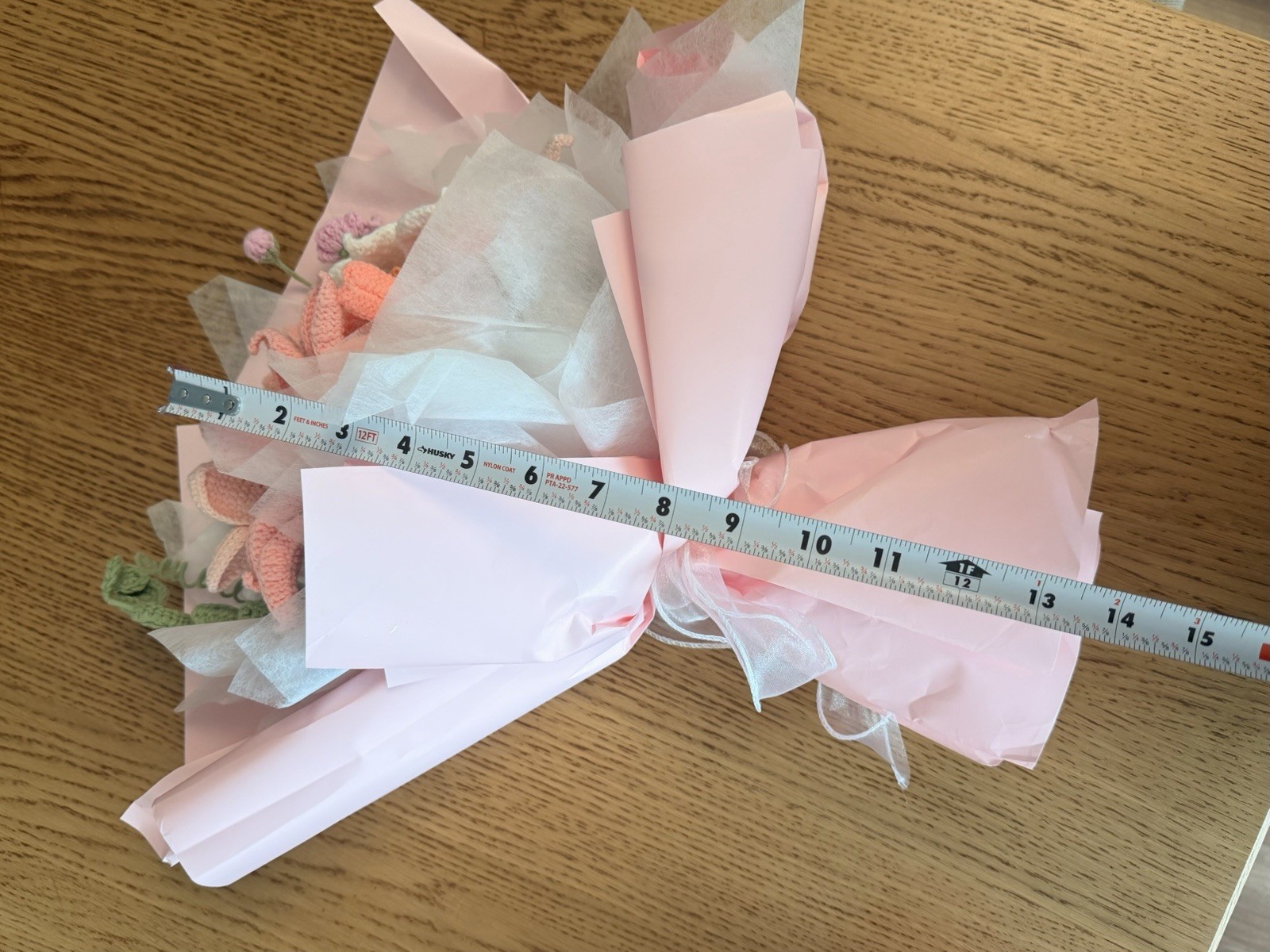 A beautiful handmade crochet flower bouquet, carefully crafted in soft pink, whi