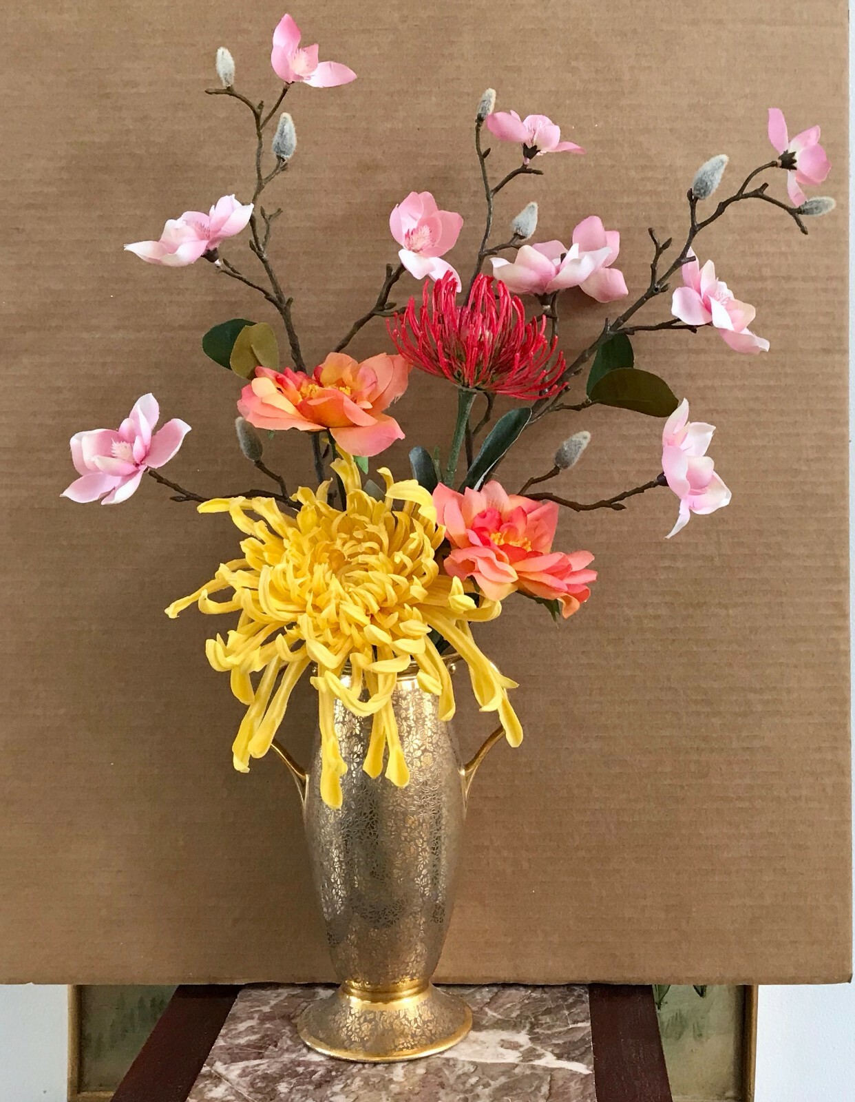Floral Arrangement with Multi-Colored Silk Flowers in a Gold Colored Floral Vase