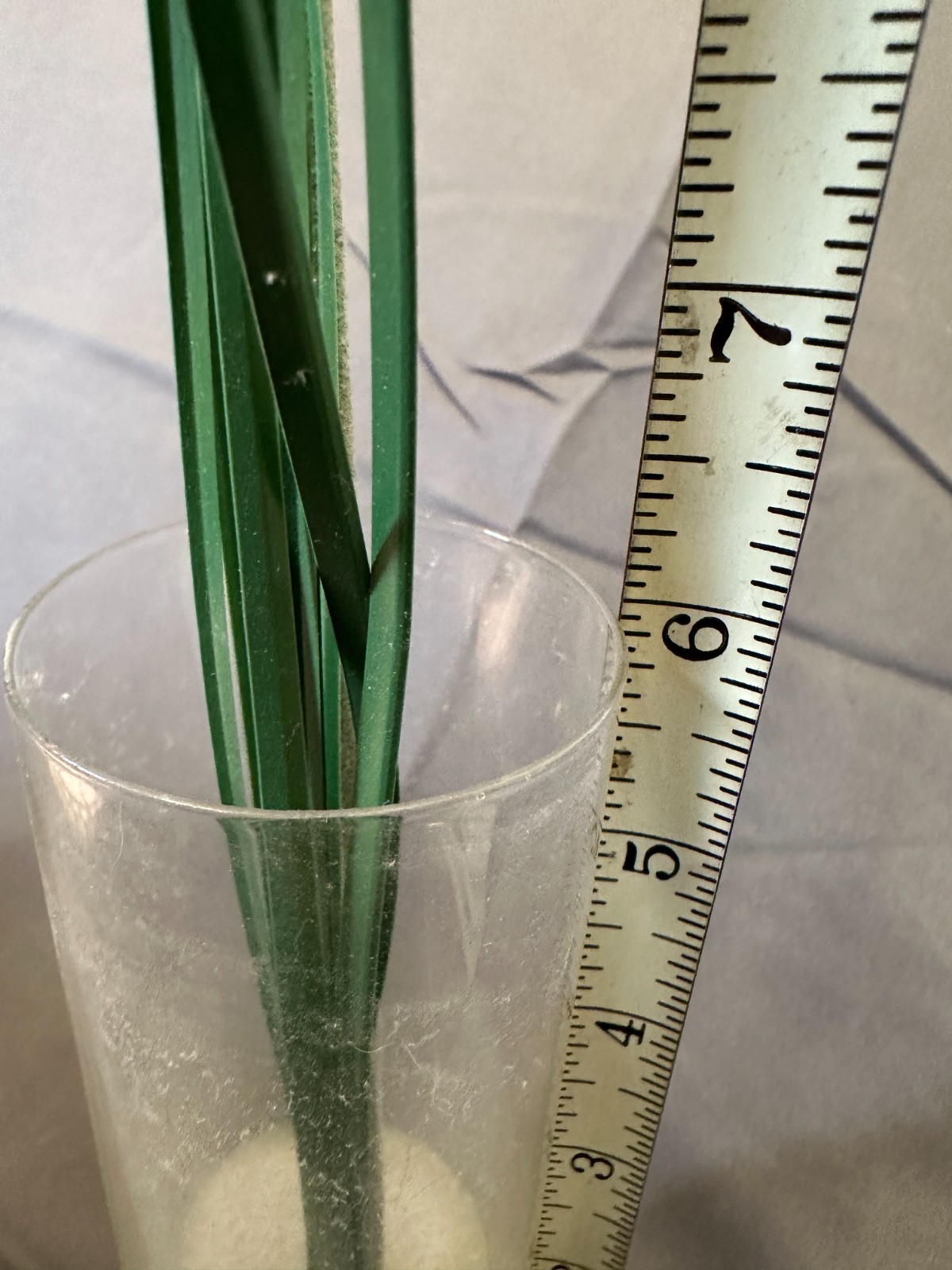 Faux Yellow Gerbera Daisy arrangement in a clear glass cylinder vase