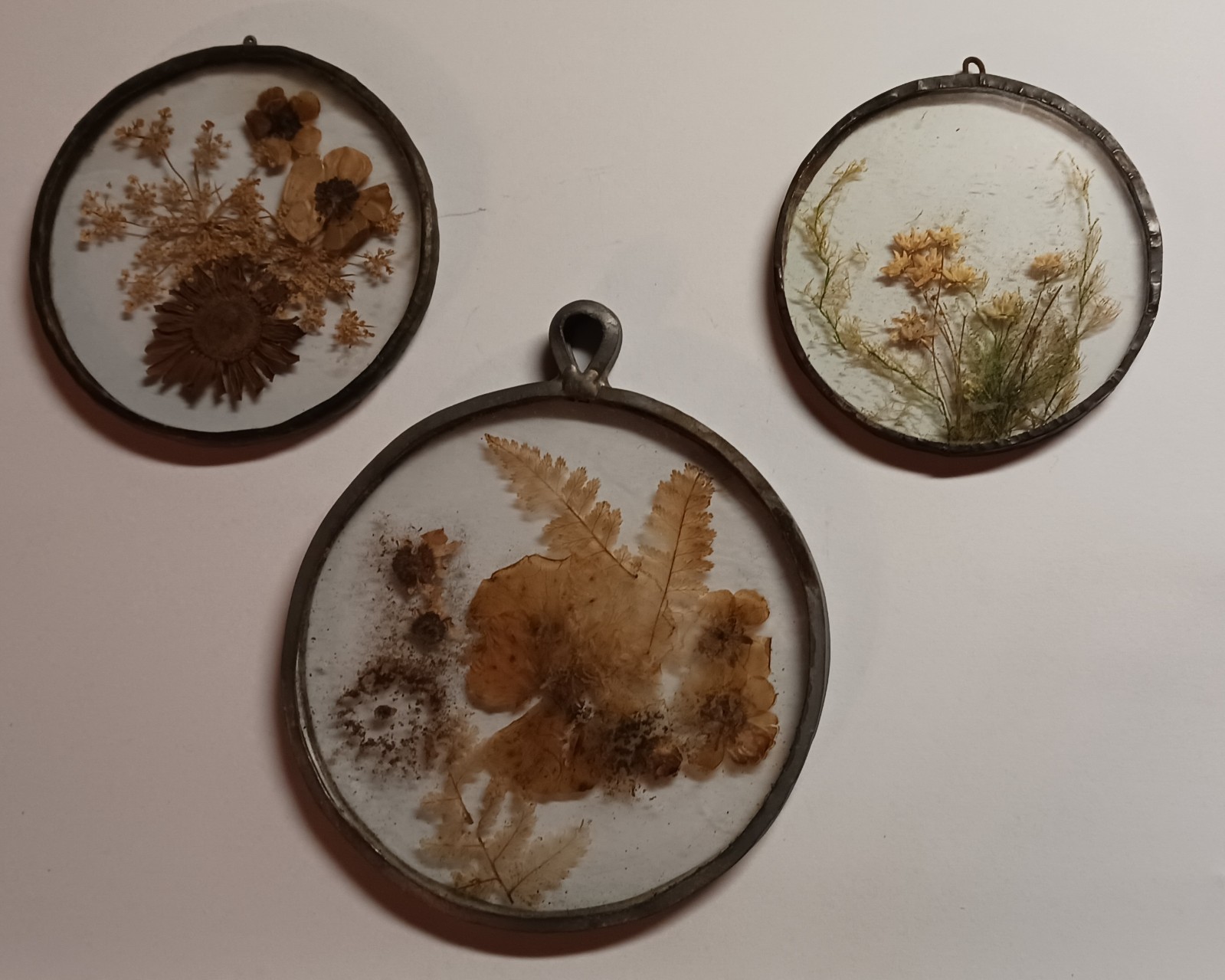 Trio of Vintage Pressed Sun Catcher Decorations with handmade lead frame/hanger