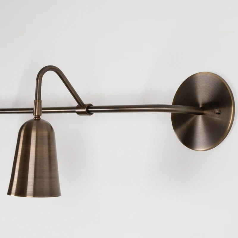 The Perry Double Sconce features solid brass hardware and powder coated aluminum