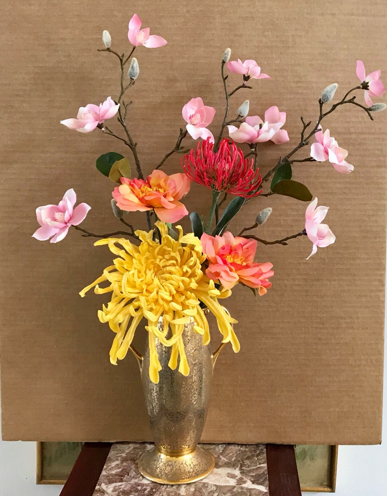Floral Arrangement with Multi-Colored Silk Flowers in a Gold Colored Floral Vase