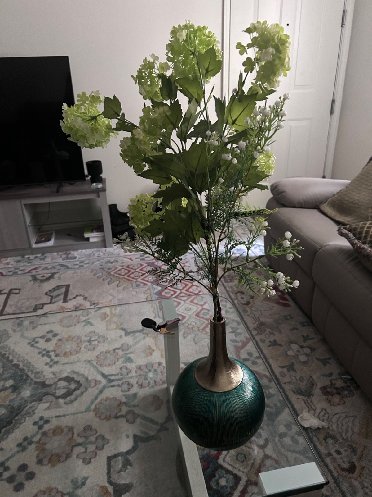 Faux Green Hydrangea stems with bulbous teal and sliver enamel vase