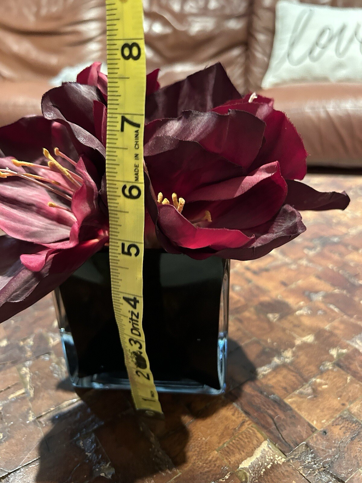 Artificial Amaryllis in Black Glass Vase
