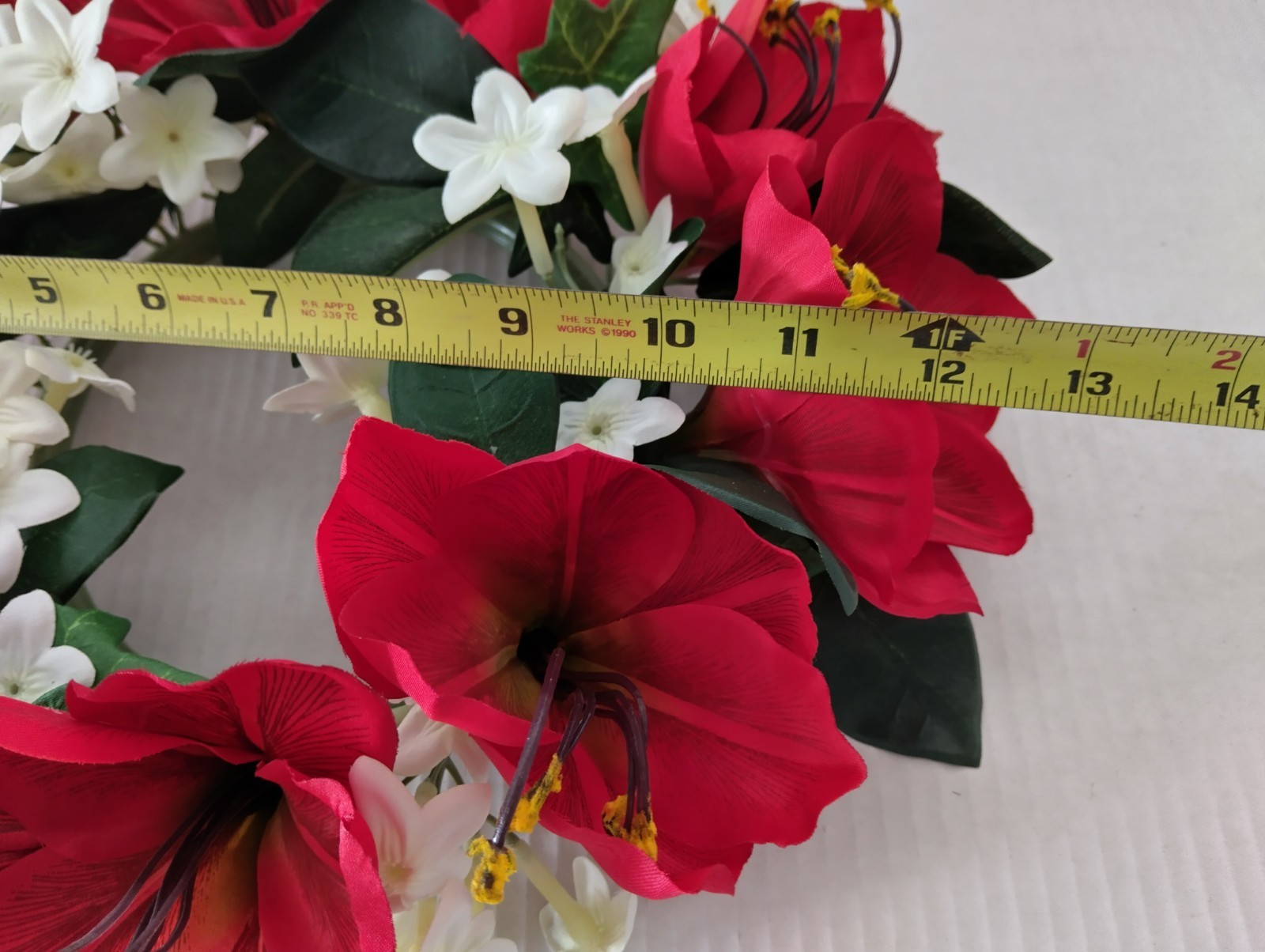 Bright red Amaryllis candle ring for a 6″ pillar candle or cremation urn.