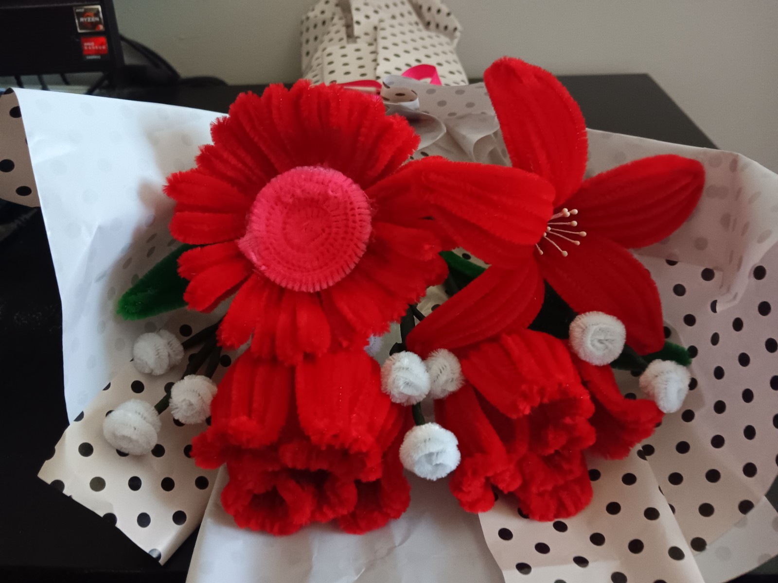 Handmade Flower Bouquet with red roses, a lily and a daisy.