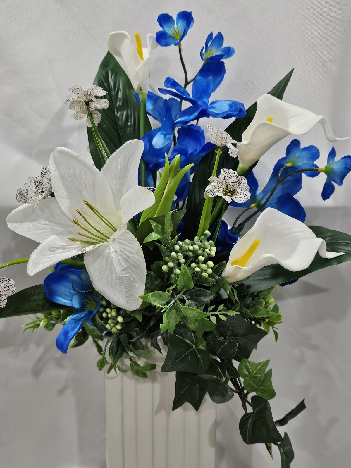 Blue with White Lilies Flower Arrangement Lush green & white ceramic vase