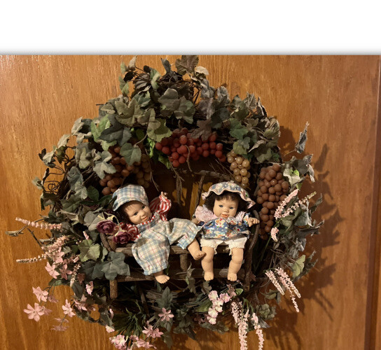 “WREATH”Floral Vinyl Twin Children Sitting In Center Of Wreath, 17”