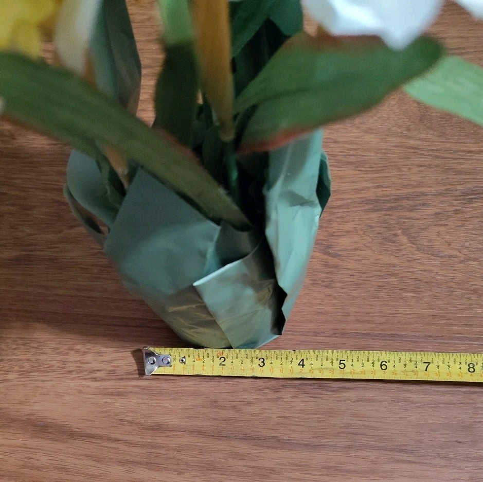 Artificial Yellow And White Daffodils In Pot With Paper
