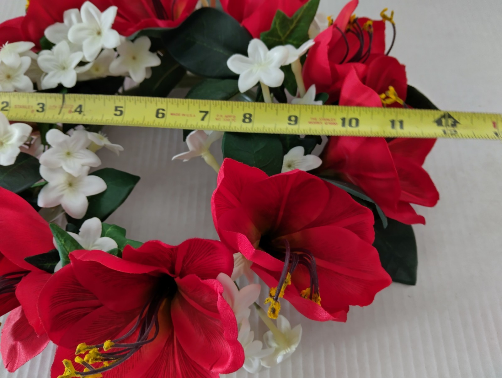 Bright red Amaryllis candle ring for a 6″ pillar candle or cremation urn.