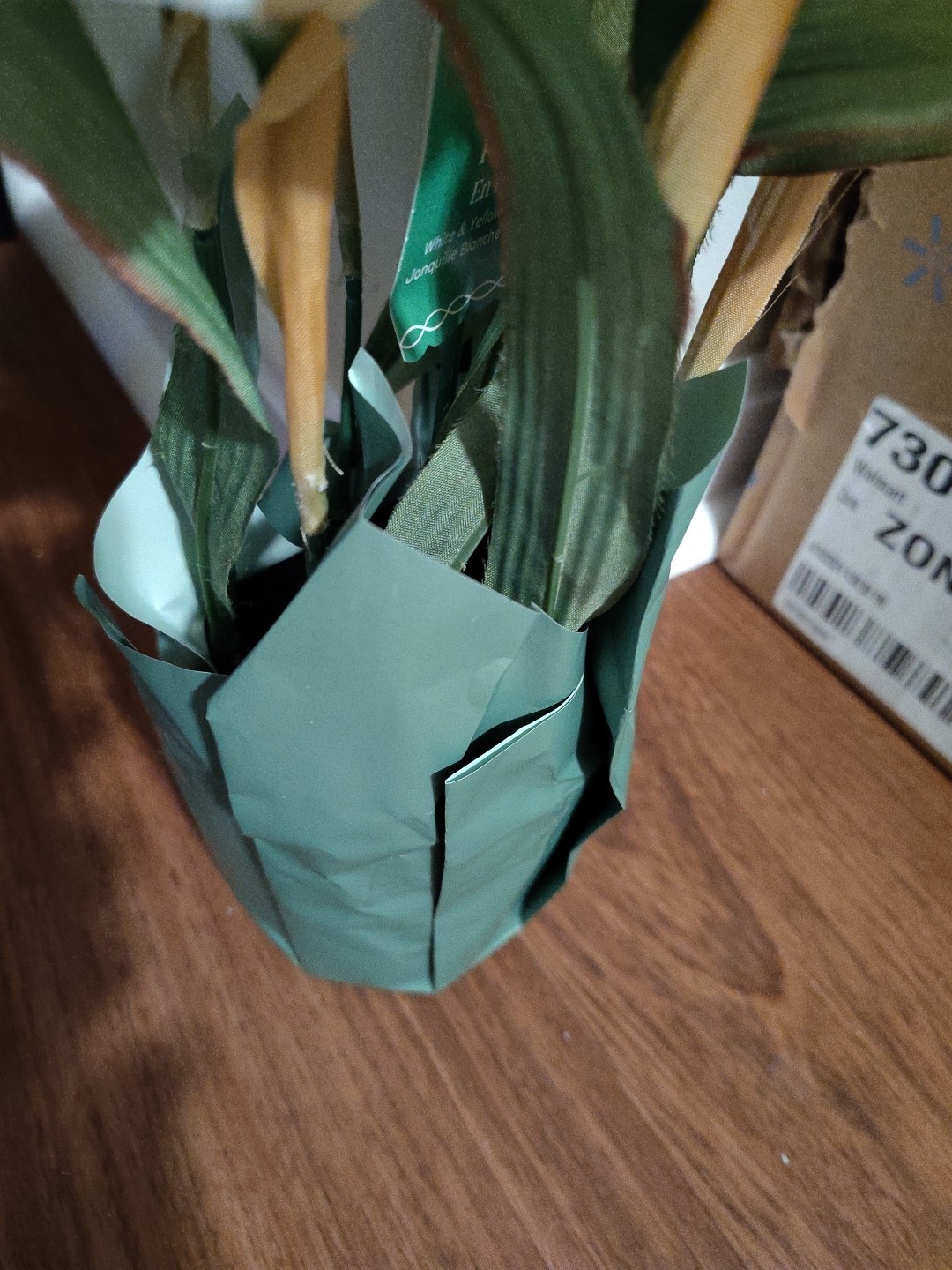 Artificial Yellow And White Daffodils In Pot With Paper