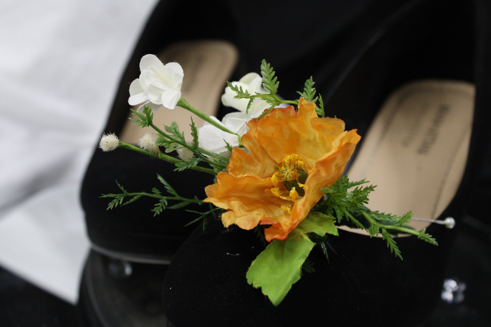 Yellow and orange poppy floral bouquet and matching boutonierrie