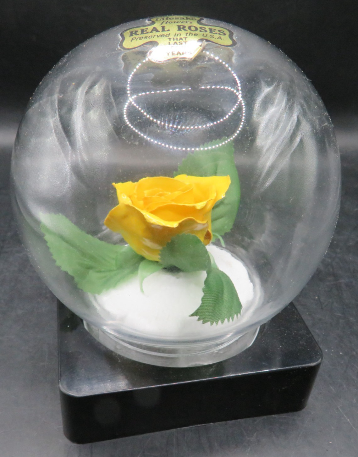 Lifesake Flowers REAL ROSES Yellow Rose In a clear globe on a back base.