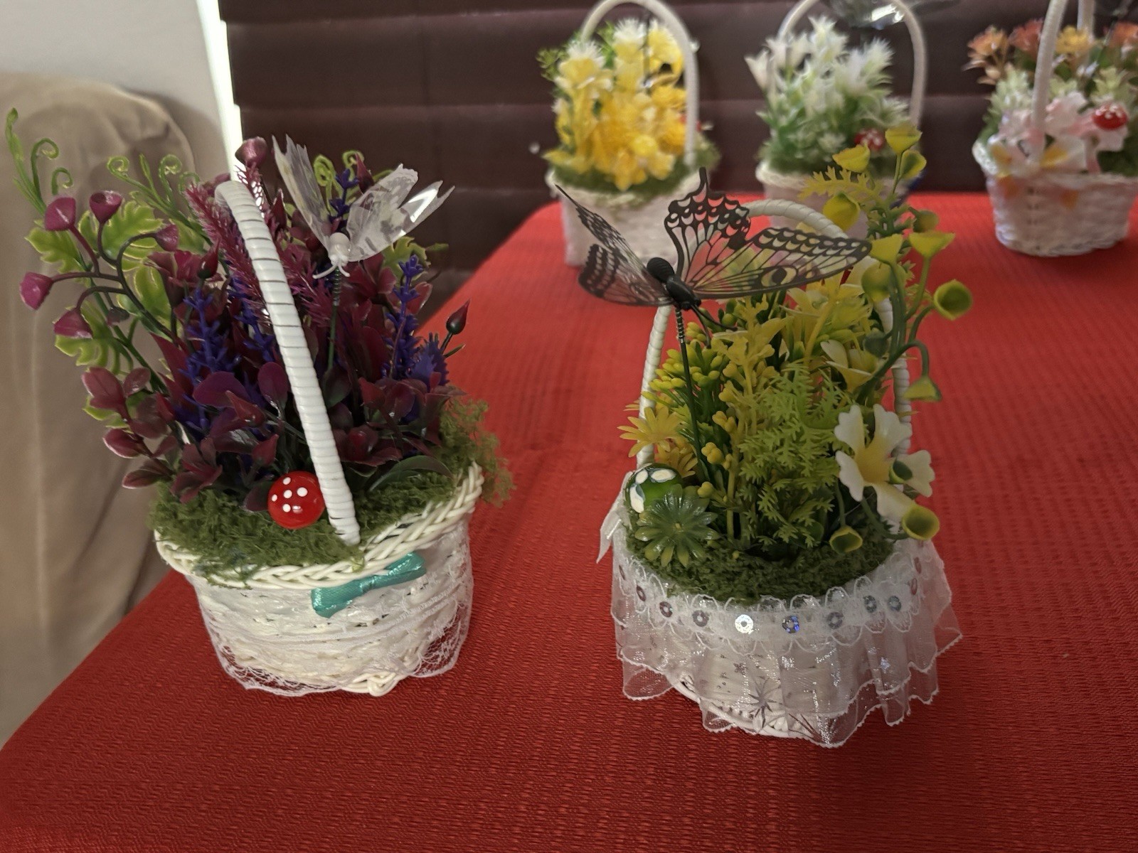 Artificial Floral Arrangement in White Wicker Baskets, Butterfly Accent