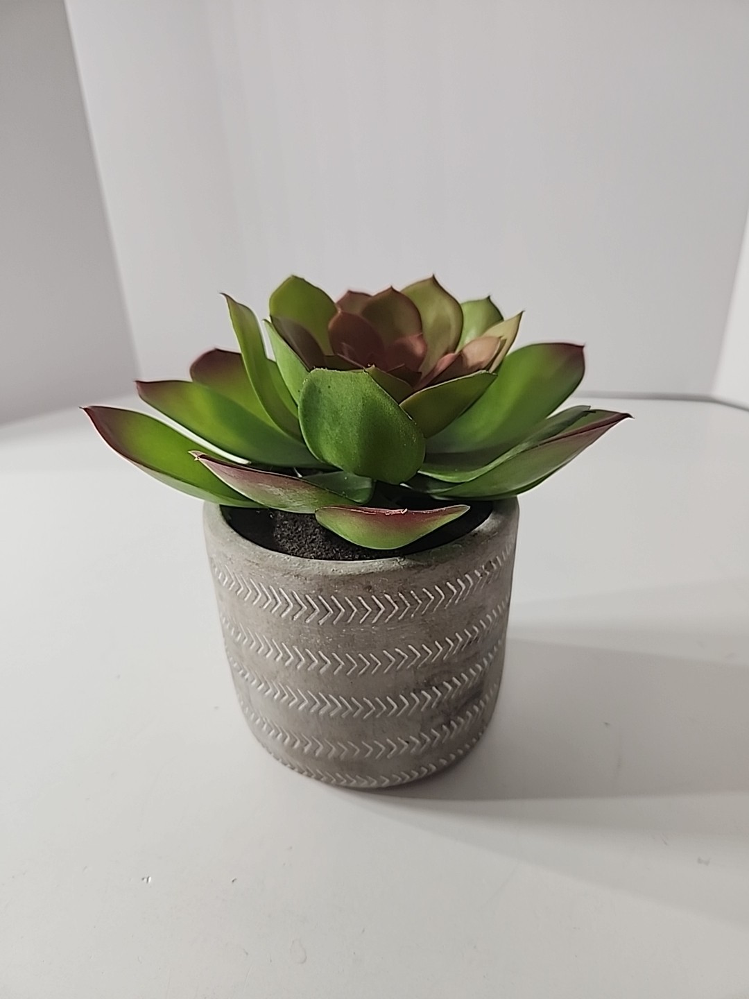 7.5 Inch Artificial House Plant In Decorative Stone Pot.