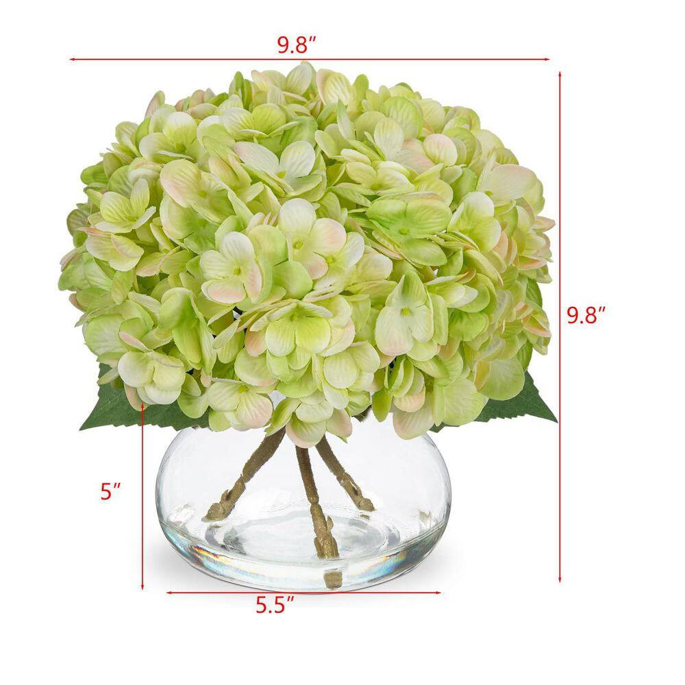 Green Artificial Flowers Paired with a Glass Vase